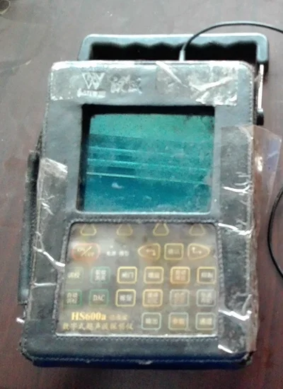 Ultrasonic testing of gas cylinder detecting internal cracks and measuring wall thickness using probe