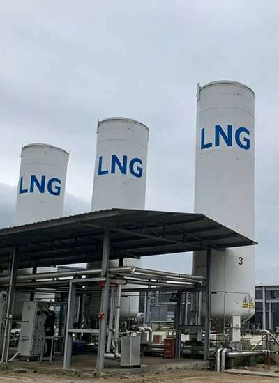 Vacuum insulated LNG storage tanks installed at an industrial facility for safe cryogenic liquefied natural gas storage 
