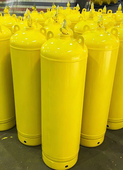 High purity ammonia gas (NH3) stored in yellow industrial ammonia tanks at BluNet Factory